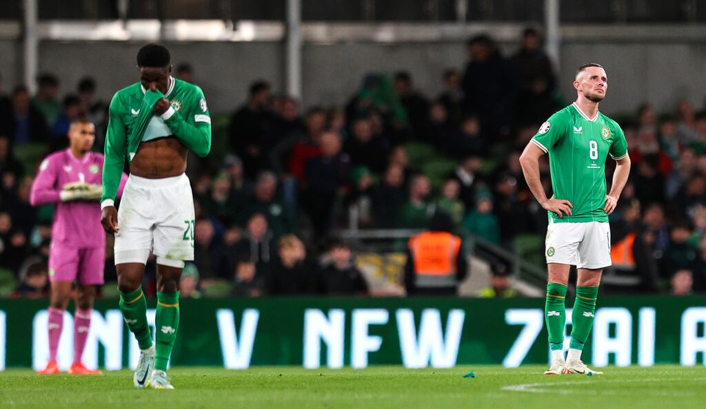 Chiedozie Ogbene and Alan Browne look dejected after Ireland conceded a second goal to Greece during the Euro 2024 qualifier at the Aviva Stadium. Photograph: Ryan Byrne/Inpho