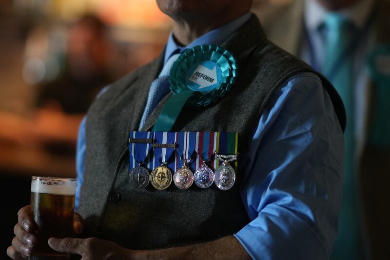 An audience member at the Reform UK party's summer rally at Staffordshire Showgrounds. Photograph: Christopher Furlong/Getty