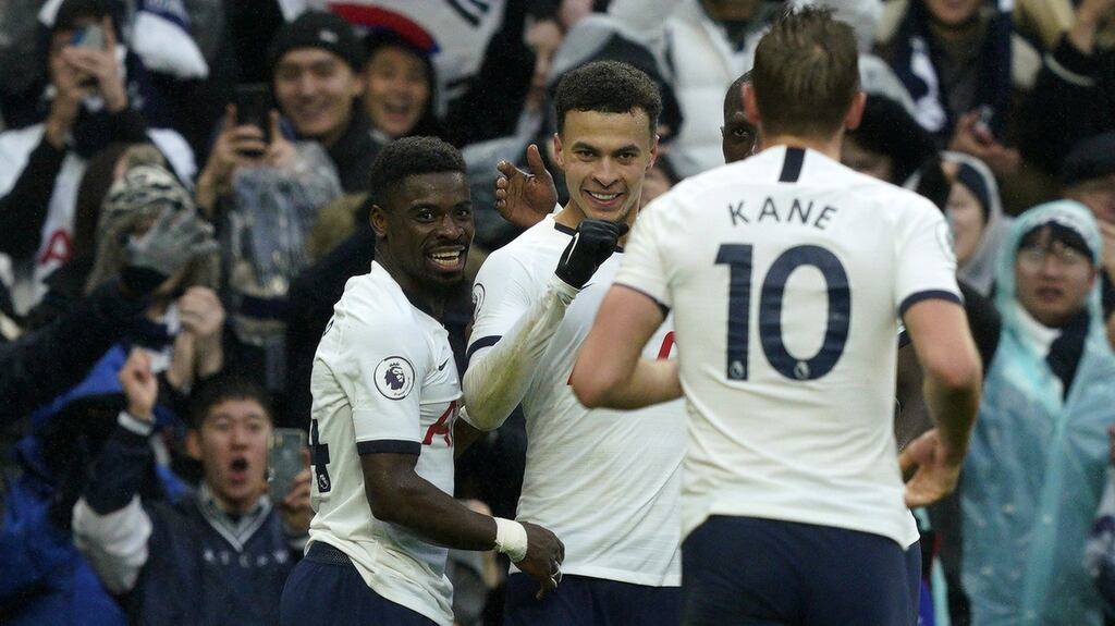 Tottenham’s Dele Alli celebrates with Serge Aurier and Harry Kane after scoring against Brighton & Hove Albion. Photograph: PA