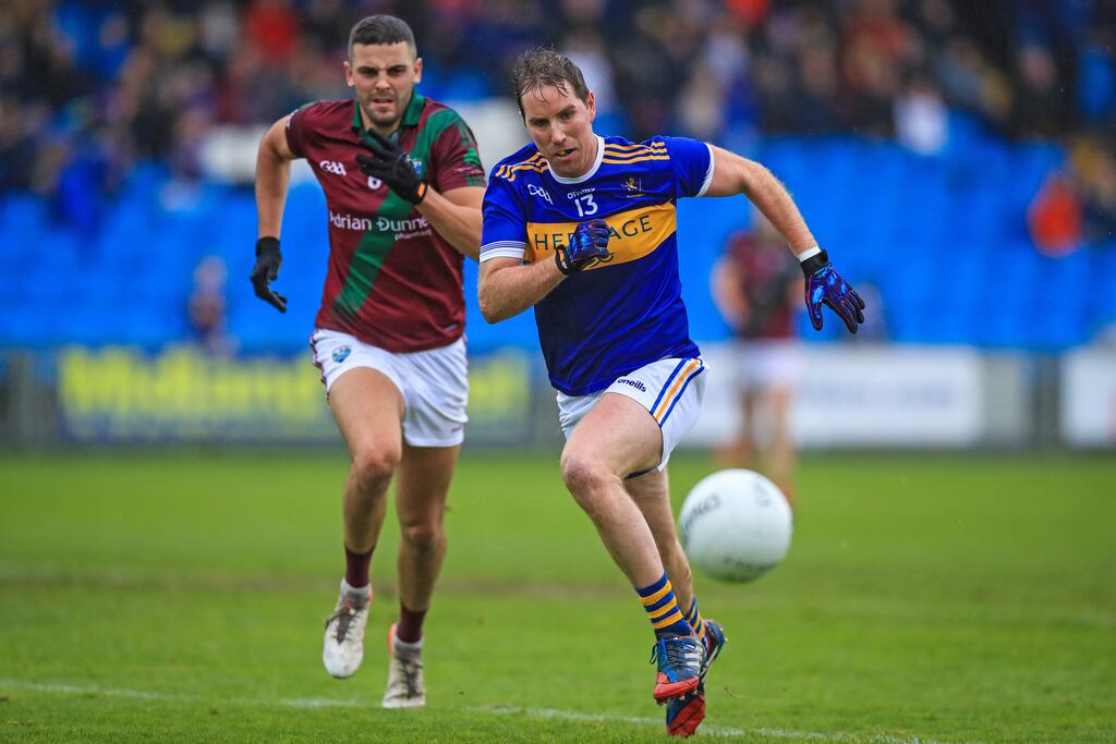 O'Dempseys' Micheal Finlay with Robbie Piggott of Portarlington. Photograph: Evan Treacy/Inpho