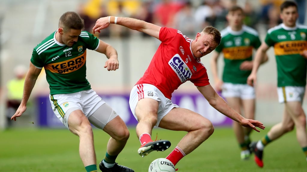 Kerry’s Stephen O’Brien and Killian O’Hanlon of Cork battle for the ball at Páirc Uí Chaoimh. Photograph: James Crombie/Inpho