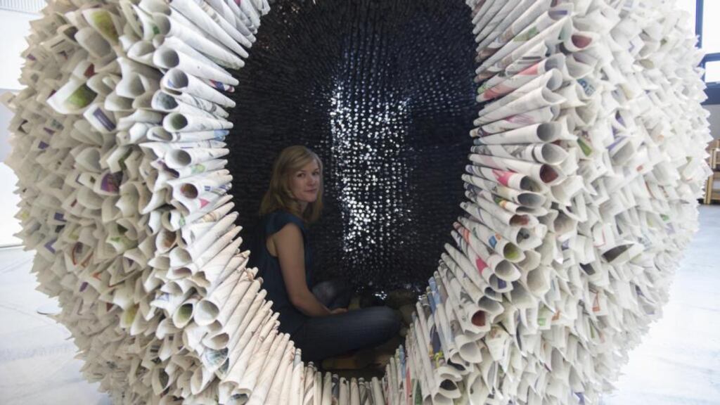Mira Koymari in her Dream Space made of newspapers