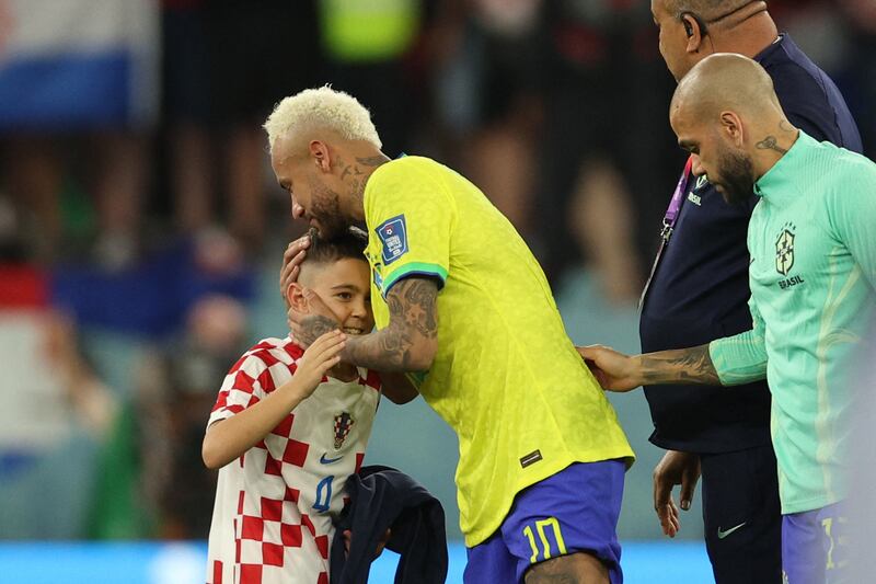 Neymar hugs the child of one of the Croatia players after the World Cup quarter-final.Photograph: Adrian Dennis/AFP via Getty Images
