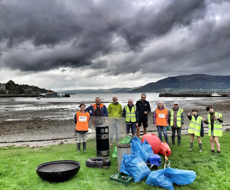 Volunteers of all ages gather litter and detritus on a Coastal Clean Up day at Templetown Beach, Co Louth.