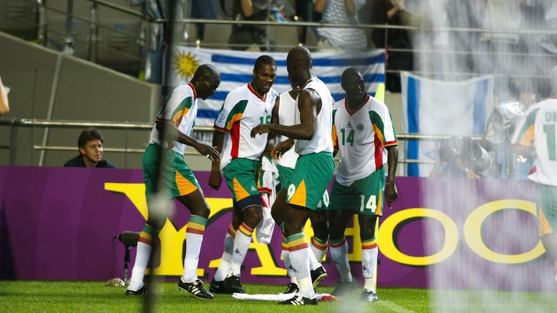 Senegal players celebrate the goal which saw them beat France at the 2002 World Cup. Photo: Getty Images