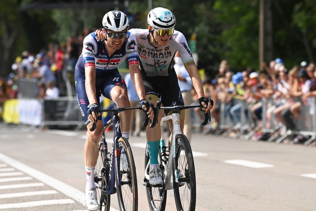 Stage winner Matej Mohoric celebrates next to Kasper Asgreen after claiming a photo finish win on stage19 of the Tour de France between Moirans-en-Montagne and Poligny. Photograph: Tim De Waele/AFP via Getty Images