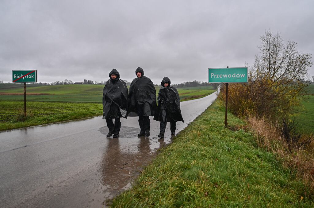 Police officerssearch and patrol around the blast site in Przewodow, Poland after the possible missile strike on the village about 10km from the border with Ukraine. Photograph: Omar Marques/Getty Image