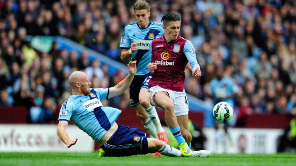 Aston Villa’s Jack Grealish is challenged by James Collins of West Ham during the Premier League match at Villa Park. Photo: Stu Forster