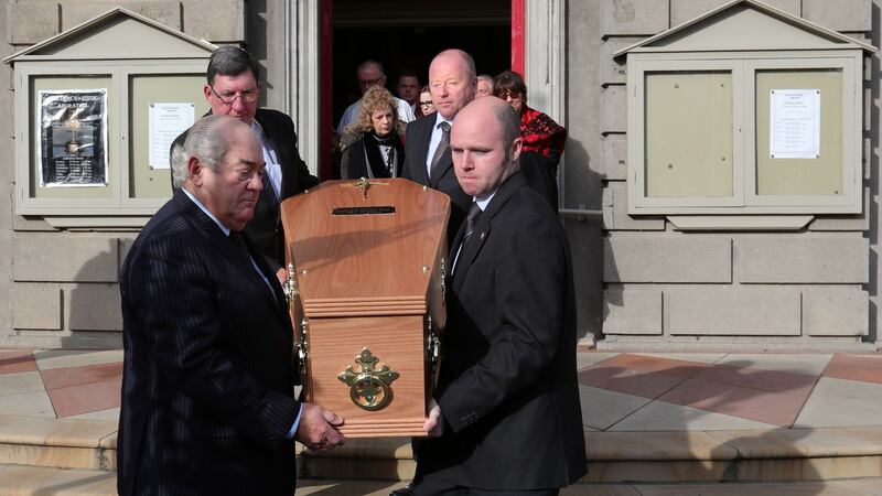 The remains are carried from church after funeral Mass. Photograph: Colin Keegan/Collins