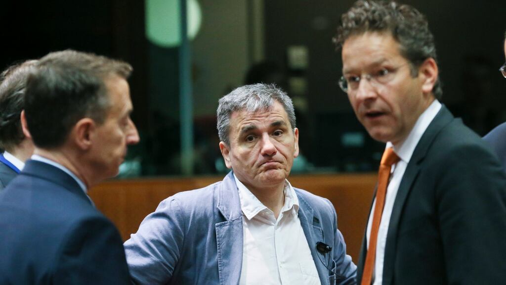 Greek finance minister Eucleidis Tsakalotos and eurogroup president Jeroen Dijsselbloem in Brussels: banking stocks rose across Europe after euro zone finance ministers unblocked €10.3 billion of new funds for Greece. Photograph: Olivier Hoslet