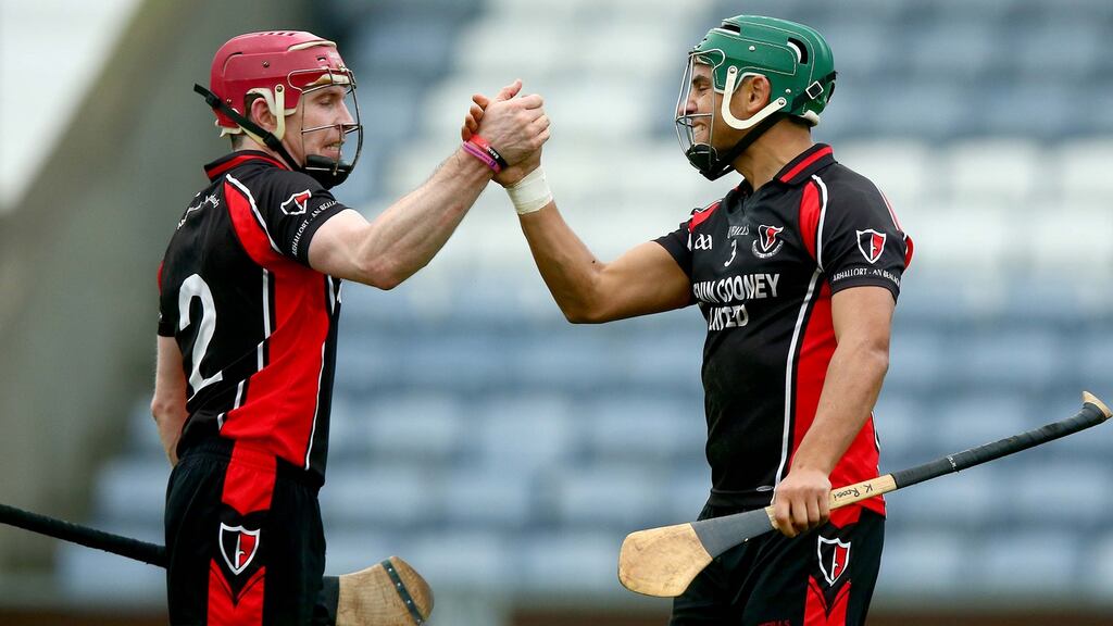 Keith Rossiter and Paul Roche of Oulart The Ballagh celebrate at the end of the game. Photo: Donall Farmer/Inpho