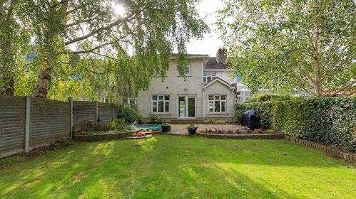 A large two-storey extension runs across the rear of 8 Nutgrove Park