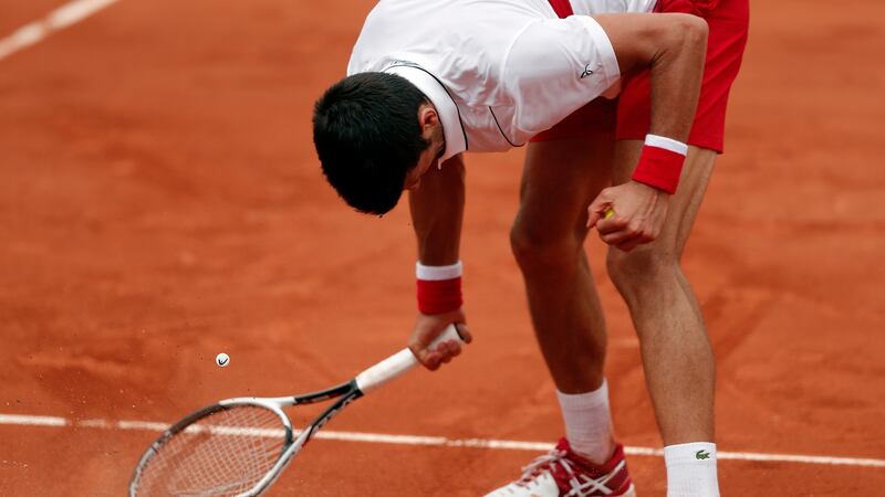 Novak Djokovic of Serbia smashes his racket during the 2018 French Open. Photograph: EPA