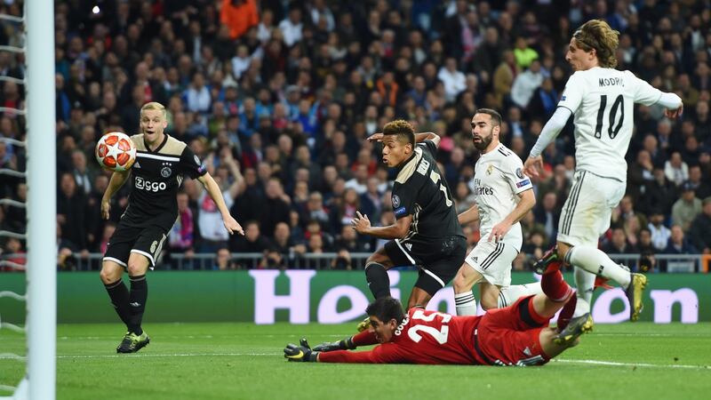 David Neres of scores Ajax’s second goal past Real Madrid goalkeeper Thibaut Courtois during the Champions League round of 16 second leg at the Bernabeu. Photograph: Denis Doyle/Getty Images