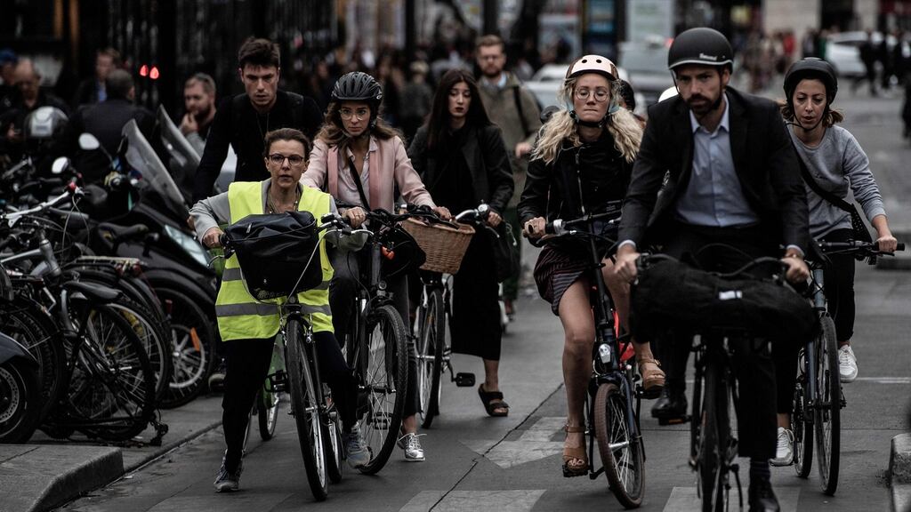 Parisians appeared to take the disruption in their stride, resorting massively to online work from home, ride-sharing, cycling and electric scooters. Photograph: Martin Bureau/AFP/Getty Images