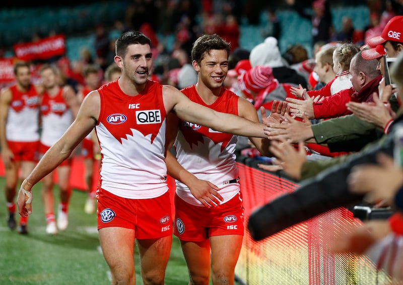 Colin O'Riordan with his Sydney Swans team-mate Oliver Florent after their win over Essendon Bombers in Sydney in May 2019. Photograph: Ryan Pierse/Getty Images)