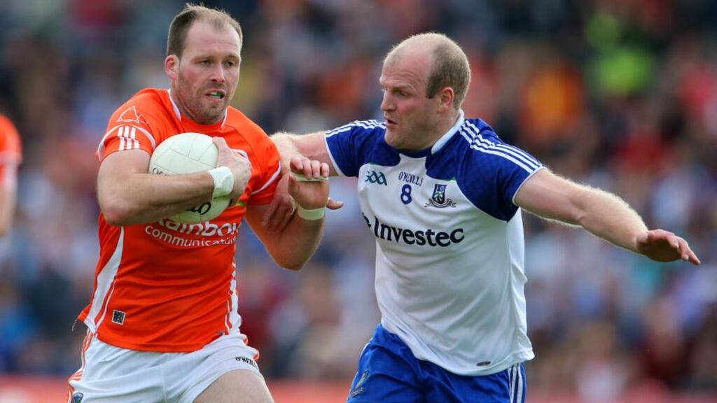 Armagh’s Ciaran McKeever is tackled by Monaghan’s Dick Clerkin during last week’s drawn encounter at St Tiernach’s Park, Clones. Photo: Cathal Noonan/Inpho