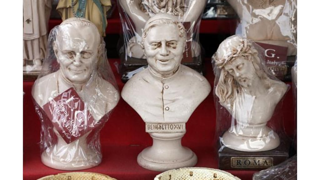 Souvenir statues of Pope John Paul II,,Pope Benedict XVI and Jesus for sale in Rome. Photograph: Peter Macdiarmid/Getty Images