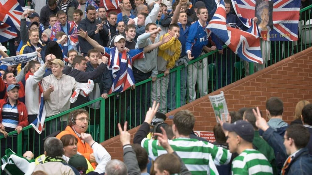 Celtic and Rangers fans taunt each other at an Old Firm derby. But can they really be seen as “two sides of the same debased coind”? Photograph: PA