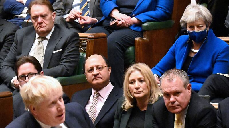 Former UK prime minister Theresa May listening to current prime minister Boris Johnson in the House of Commons. Photograph: Jessica Taylor/UK parliament/AFP via Getty