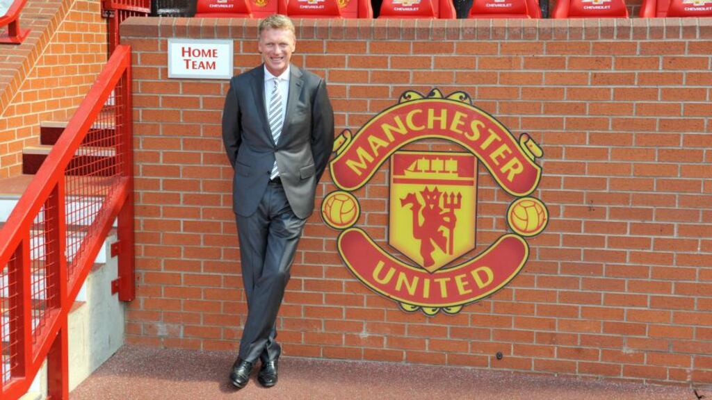 New Manchester United manager David Moyes  in the home team dug out  at Old Trafford. Photograph:  Martin Rickett/PA