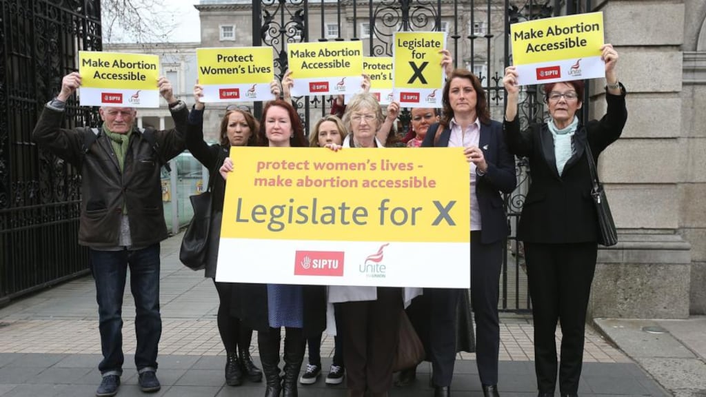 Protesters from the Siptu and Unite trade unions at Leinster House yesterday calling on the Government to legislate for the X case. Photograph: Julien Behal/PA