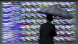 Investors dump stocks, seek safe havens as bank fears flare