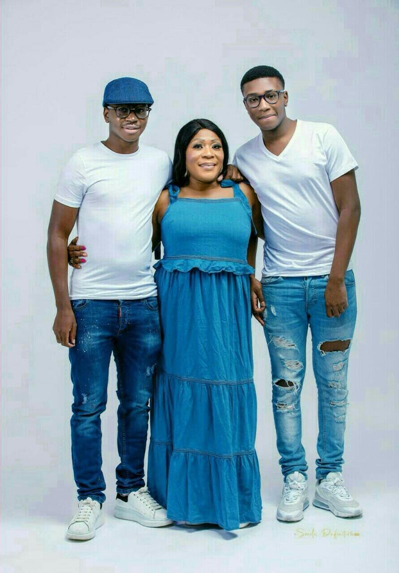 Tega Agberhiere with his mother Christie and younger brother Runo.
