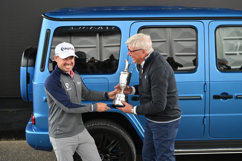 Brian Harman returns the Claret Jug to CEO of The R&A Martin Slumbers ahead of the 152nd British Open at Royal Troon. Photograph: Andy Buchanan/AFP/Getty Images