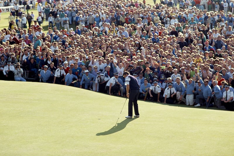 Nick Faldo of England holes the winning putt on the 18th green during the 119th Open Championship played on the Old Course at St Andrews in 1990. Photograph: Getty Images/Getty
