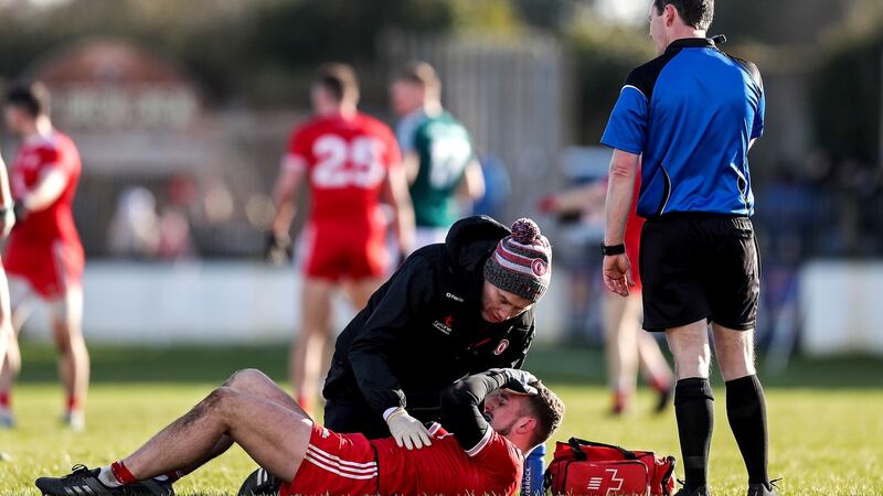 Tyrone’s Niall Sludden receives medical attention. Photo: Laszlo Geczo/Inpho