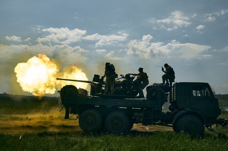 Ukrainian soldiers fire a cannon near Bakhmut. Photograph: AP Photo/Libkos