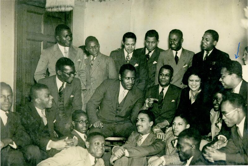 Singer Paul Robeson in Ferdinand Levy's Baggot Street flat, c. 1935, with members of the Association of Students of African Descent. Levy has the blue arrow over his head. Photograph courtesy of Karen Greene