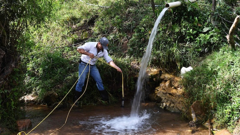 Victor Sandoval of the University of San Carlos of Guatemala collects water samples for analysis near the Lempa river source in Olopa, east of Guatemala city. Photograph: Marvin Recinos/AFP/Getty Images
