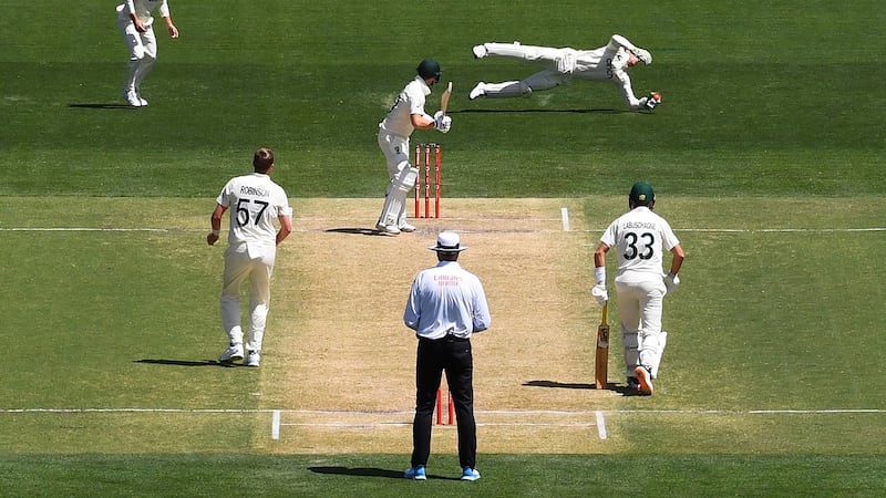 Jos Buttler catches from Steve Smith. Photo: Dave Hunt/EPA