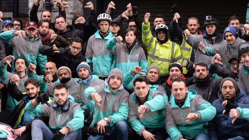 Up to 100 Deliveroo  delivery workers gathered at the Dublin offices of Deliveroo on Friday to protest over  attacks on them while they are working in the city. Photograph: Alan Betson/The Irish Times