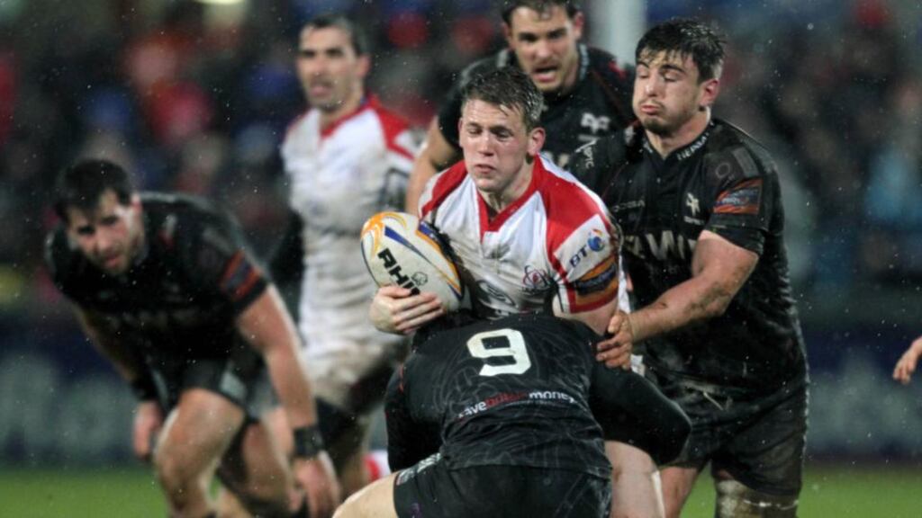 Ulster’s Craig Gilroy is tackled by Ospreys’ Tom Habberfield and Sam Lewis during last night’s RaboDirect Pro12 game in Ravenhill. Photograph: Darren Kidd/Inpho/Presseye