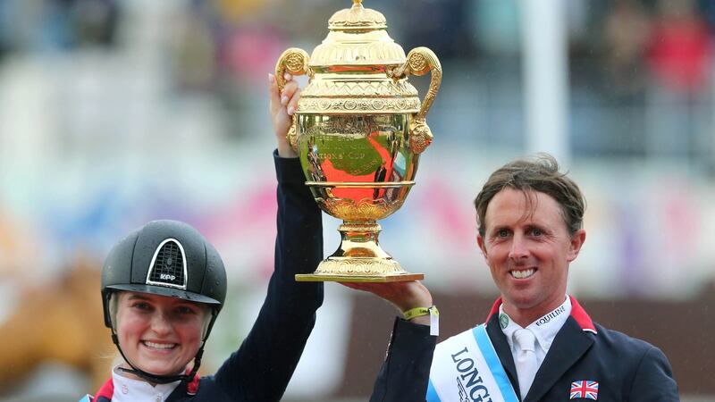 Great Britain’s Emily Moffitt and Ben Maher celebrate winning the Aga Khan Trophy at the Dublin Horse Show. Photograph: Lorraine O’Sullivan/Inpho