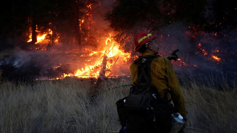 Firefighters battle a wildfire near Santa Rosa. Photograph: REUTERS/Jim Urquhart