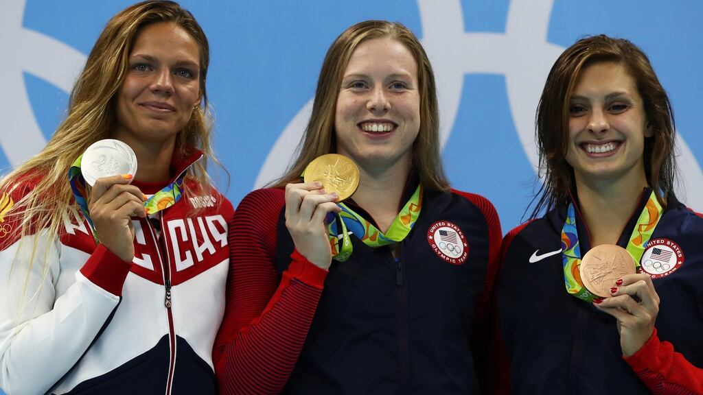 Left to right: Silver medalist Yulia Efimova of Russia, gold medalist Lilly King of the United States and bronze medallist Katie Meili of the United States pose on the podium during the medal ceremony for the Women’s 100m breaststroke final in Rio de Janeiro. Photograph: Getty Images