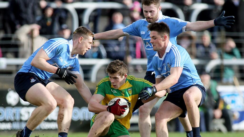 Donegal’s Eoghan Ban Gallagher with Dublin’s John Small, Jack McCaffrey and Eric Lowndes at Ballybofey on Sunday. Photograph: INPHO