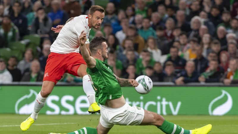 Haris Seferovic has his shot blocked by a sliding Shane Duffy. Photo: Georgios Kefalas/EPA