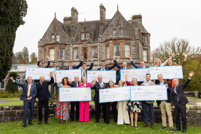 Winners in the inaugural North-South Business Cooperation Awards at Castle Leslie in Co Monaghan pictured with awards founder Stelios Haji-Ioannou, centre on the lower tier. Photograph: Naoise Culhane
