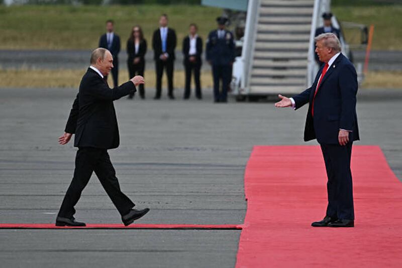US president Donald Trump extends his hand to greet Russian president Vladimir Putin in Alaska. Photo: Andrew Caballero-Reynolds/AFP via Getty Images
