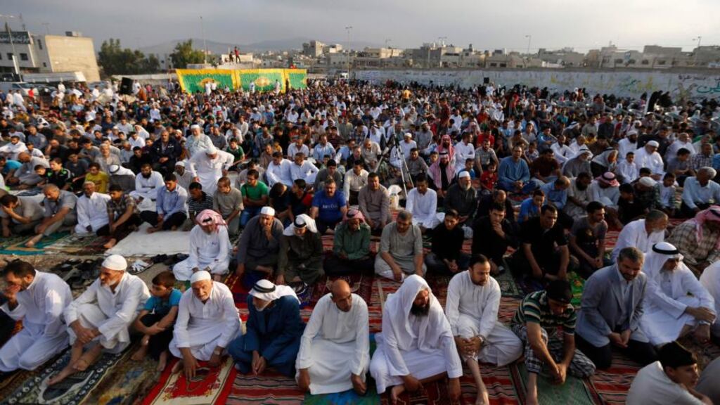 Palestinian refugees perform Eid al-Fitr prayers at Al-Baqaa Palestinian refugee camp. The Seanad is being recalled from its summer break and Minister for Foreign Affairs Charlie Flanagan is preparing to address Senators about Ireland’s approach to the ongoing crisis in Gaza. Photograph: Muhammad Hamed/Reuters
