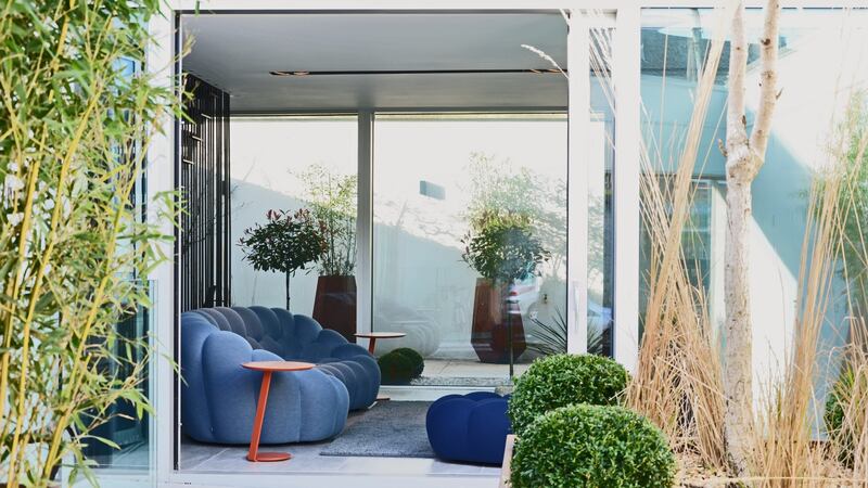 The house opens into the lounge where there is a gas stove, set around sofas by Roche Bobois