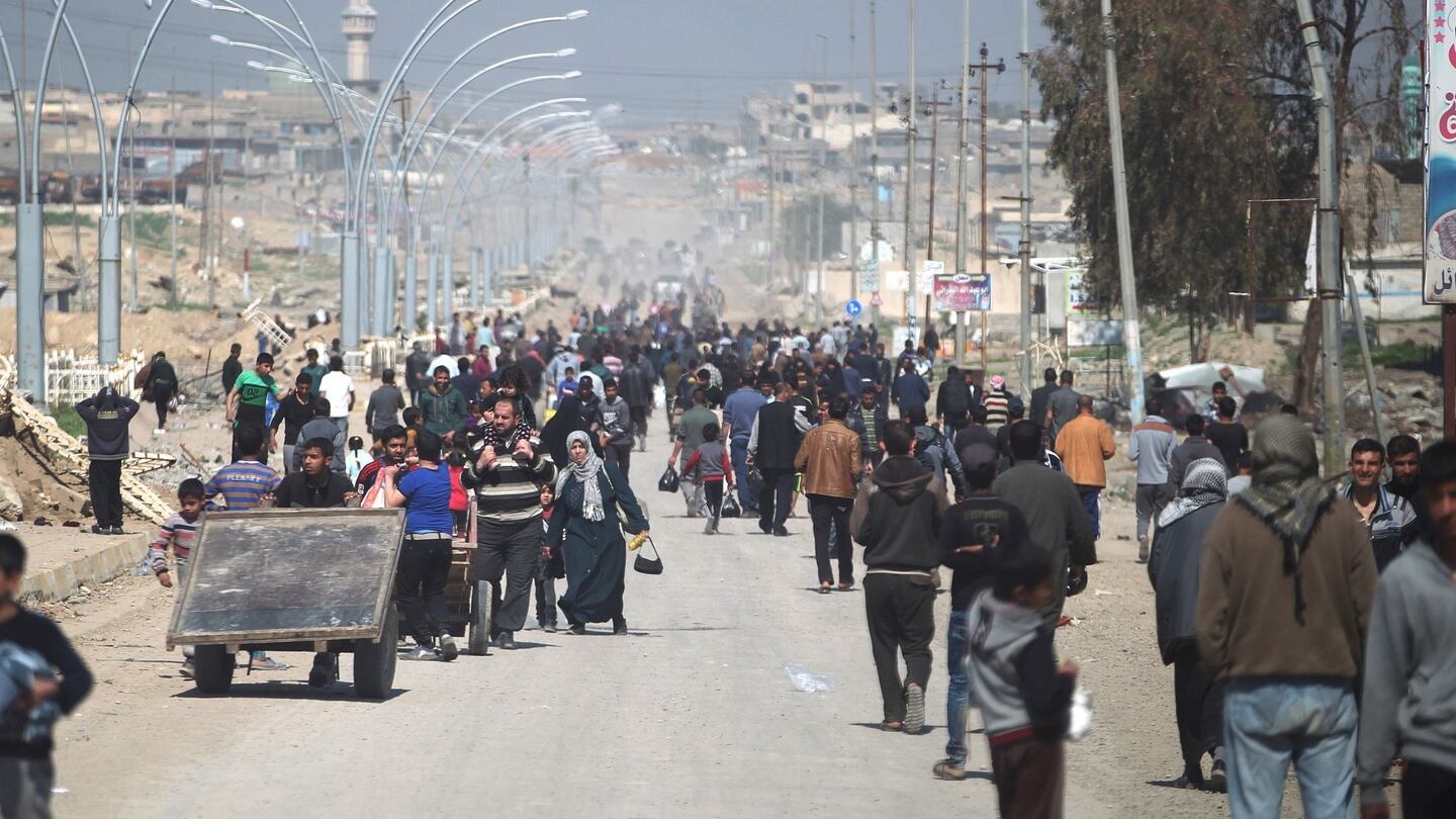 Residents of Mosul fleeing the fighting against Islamic State   on Sunday. Photograph: Ahmad al-Rubaye/AFP/Getty Images