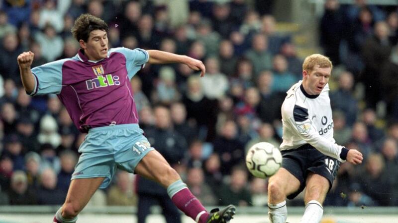 Barry playing against Manchester United during his early days at Aston Villa. Photo: Getty Images