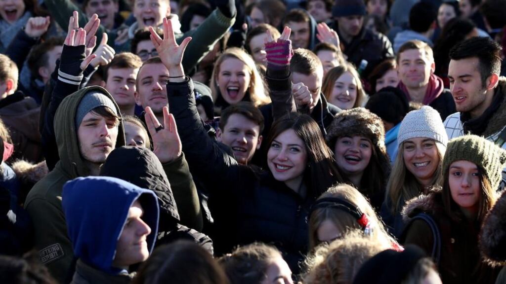 People wave and cheer as they queue outside the Bristol Arnolfini art centre, England for open Star Wars auditions. Photograph: Matt Cardy/Getty Images