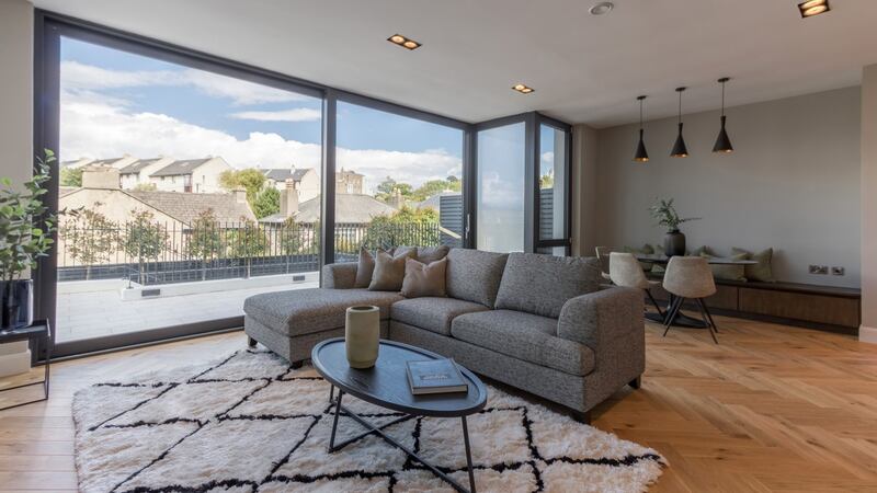 The living room, which spans the width of the house at entrance level